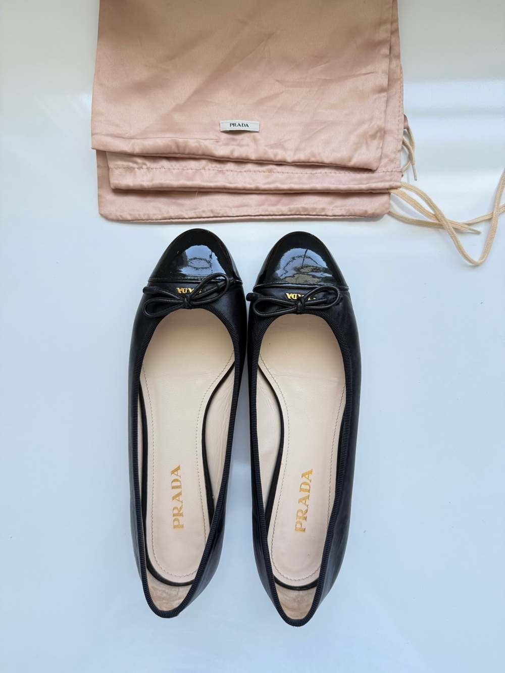 Prada Black Leather Ballet Flats with Patent Cap Toe and Bow - Picture 3 of 5
